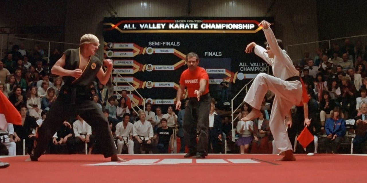 Martial artist woman double kicks accurately